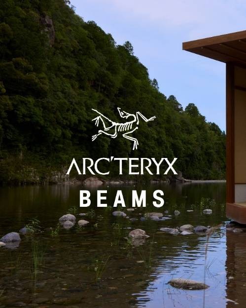 A body of water with a building and a logoDescription automatically generated